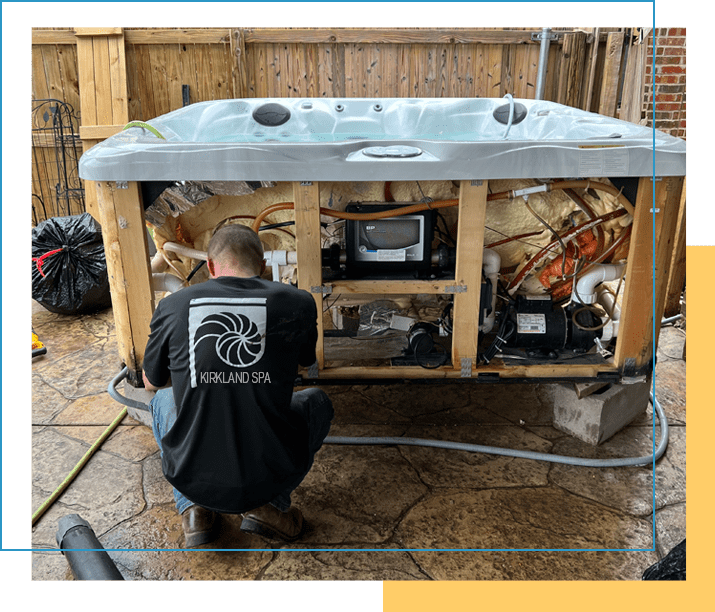 A man working on an outdoor hot tub.